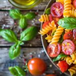 Fresh Tomato Basil Pasta in a rustic bowl with bright tomatoes and basil.